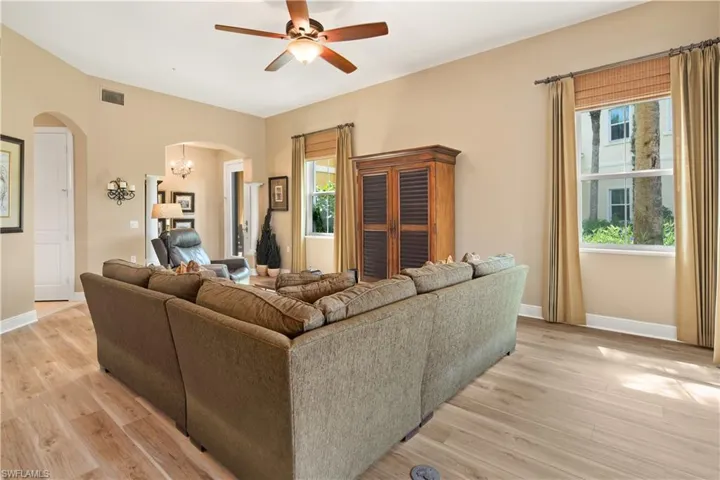 Living room featuring light hardwood / wood-style flooring and ceiling fan
