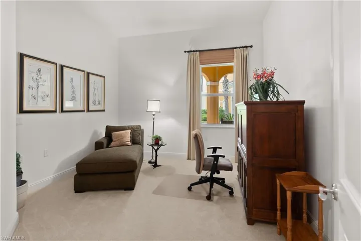 Office space featuring light carpet