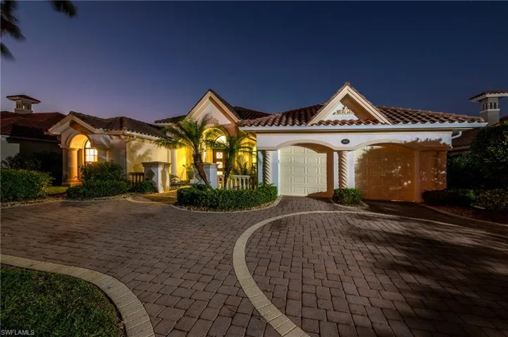 Mediterranean / spanish house featuring a garage