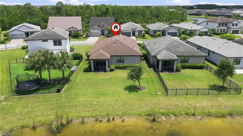 Waterfront home situated on expansive grounds with mature landscaping and manicured lawn