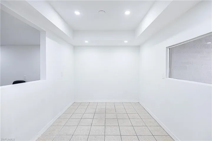 Unfurnished room featuring recessed lighting and light tile patterned floors