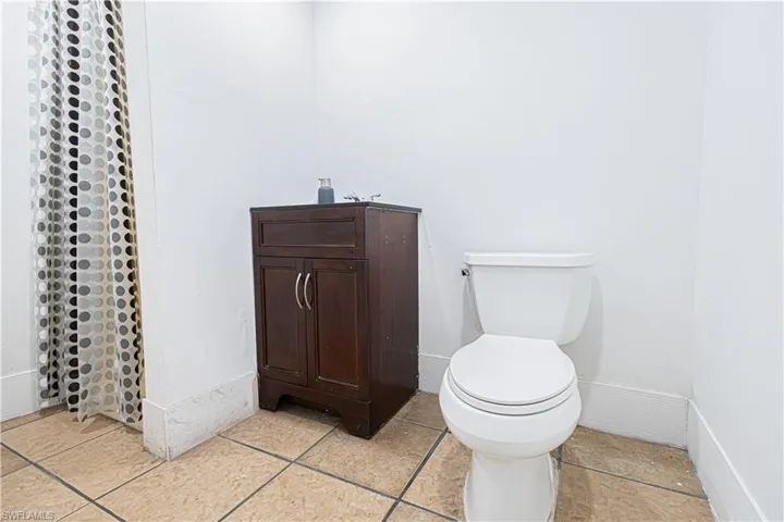 Bathroom with baseboards and toilet