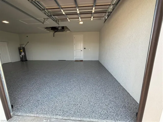 Garage featuring water heater