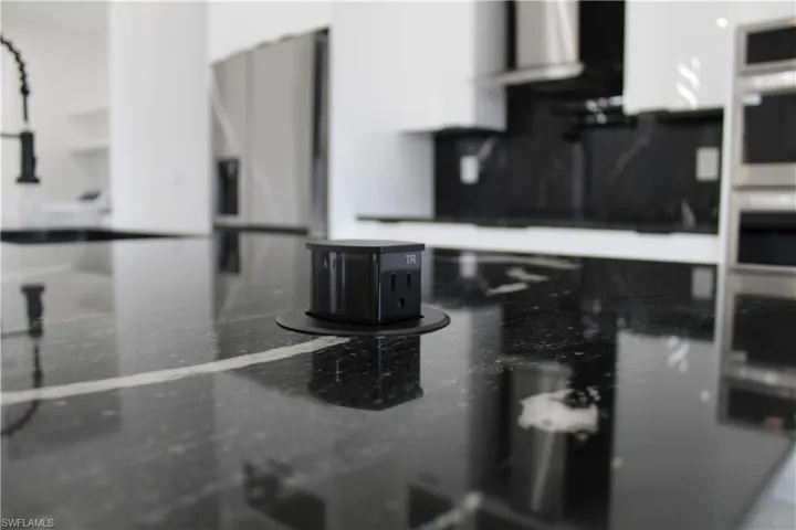 Kitchen view of extractor fan and oven