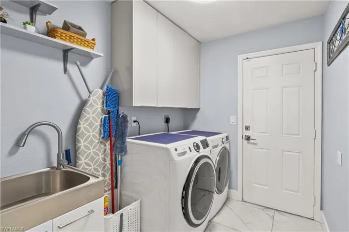 Sleek and functional, the laundry area combines convenience with clean, modern design.