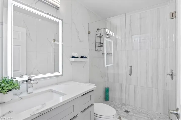 Beautifully updated guest bathroom with modern fixtures and finishes, designed to impress guests!