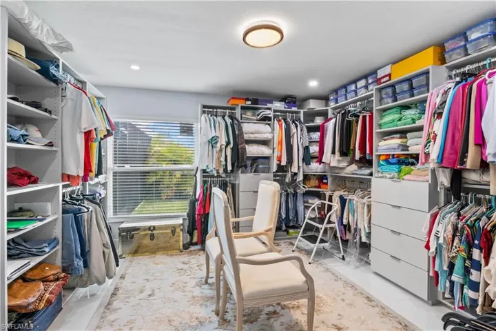 Massive 13’x13’ custom walk-in closet with plenty of room to organize, accessorize, and impress.