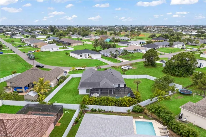 From above, the huge backyard unfolds with room to relax, entertain, and grow—your private outdoor sanctuary.