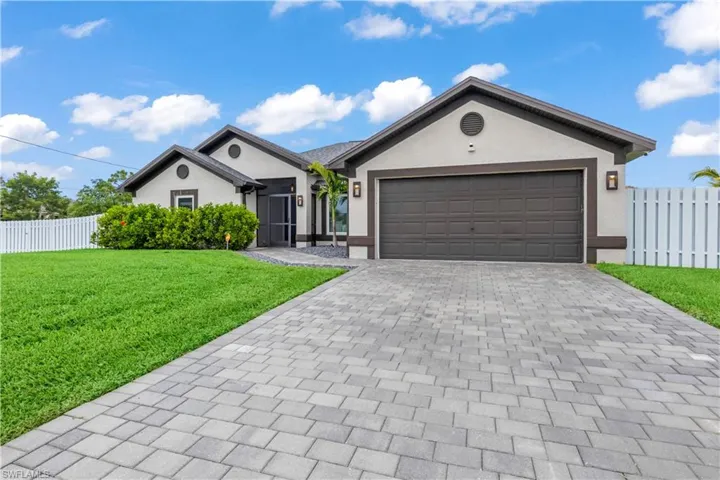 Curb appeal meets modern elegance with a like new roof, fresh landscaping, and an oversized driveway that welcomes you home.