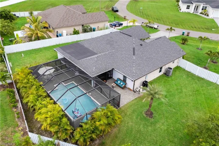 This aerial shot reveals the true scale of the oversized backyard—perfect for pool parties!