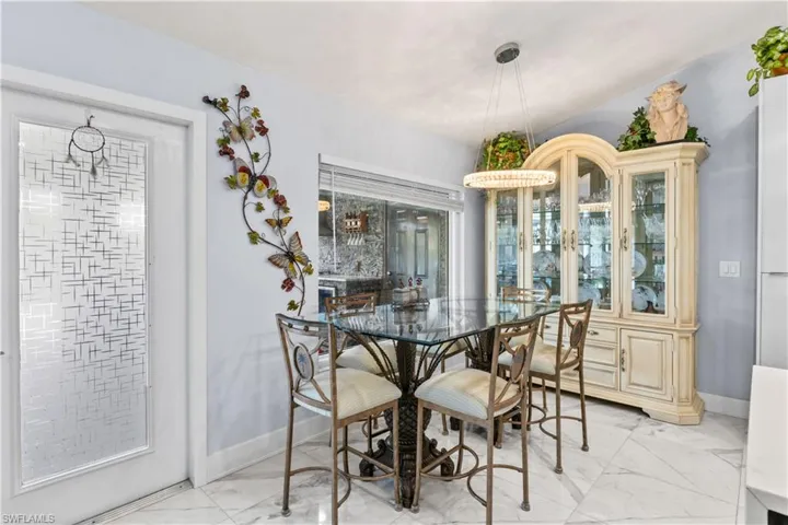Open and inviting—perfectly positioned for effortless entertaining or cozy family meals with a view of the pool.