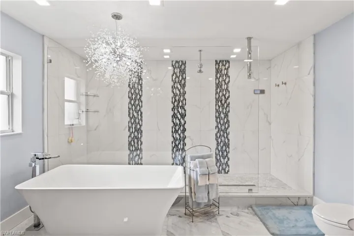 Luxury defined—featuring a soaking tub, walk-in shower, and dual vanities.