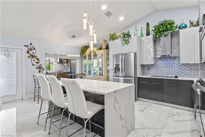 A chef’s dream kitchen with soft-close cabinetry, designer backsplash, and a spacious island.
