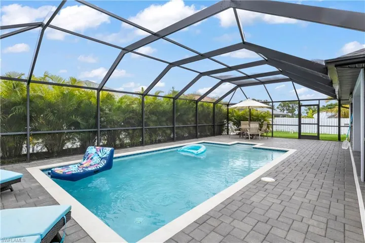 Cool off or soak up the sun in this stunning backyard escape.