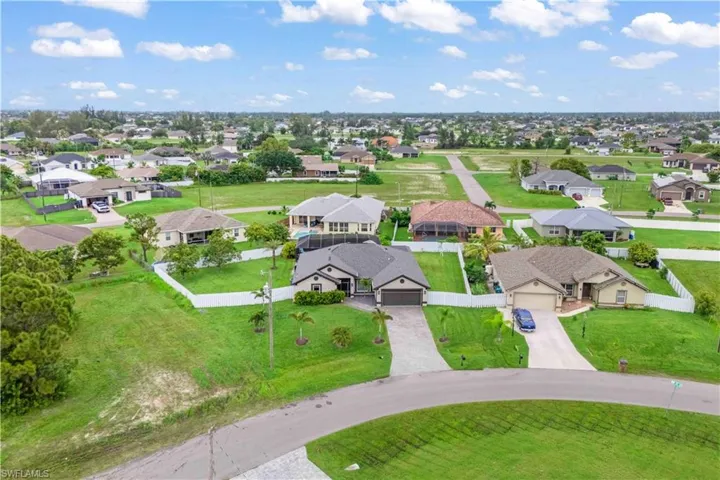 A rare find with room for it all—pool, outdoor kitchen, lush yard, and even space for a pickleball court or boat.