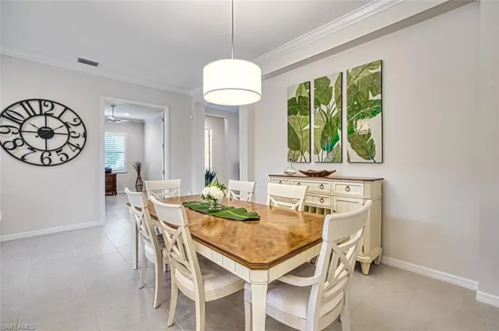 Tiled dining room with ornamental molding