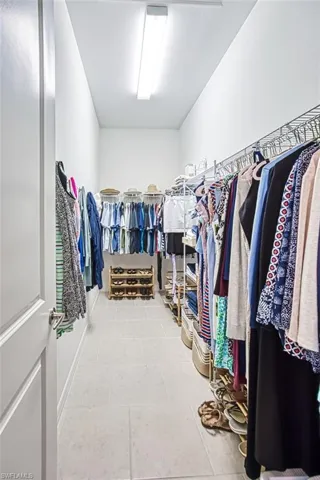 Spacious closet with tile patterned floors