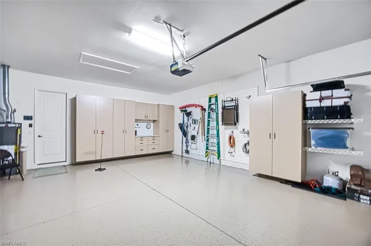 Garage featuring a garage door opener