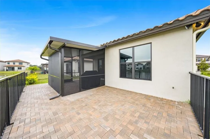 Fenced patio with w/extended pavers