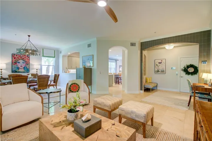 Elevator opens into foyer and living room with lanai view