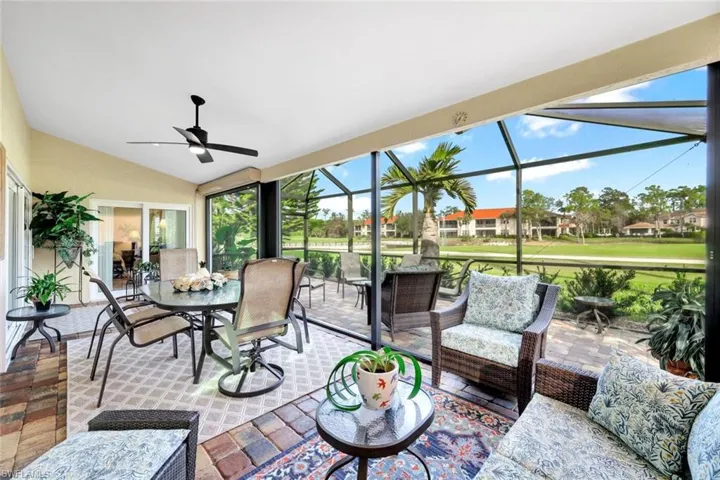Sunroom / solarium featuring ceiling fan and lofted ceiling