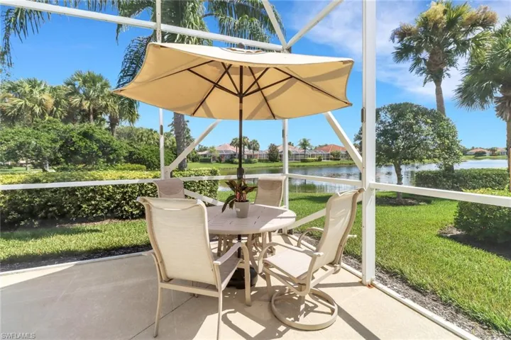 Sunroom featuring a water view