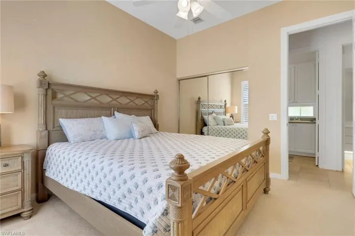 Bedroom featuring light carpet and ceiling fan