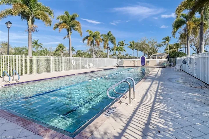 Community pool with a patio