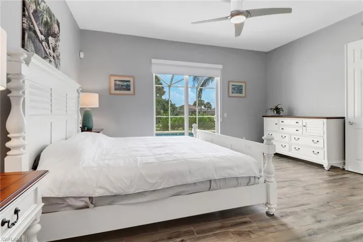 Bedroom featuring wood finished floors and ceiling fan