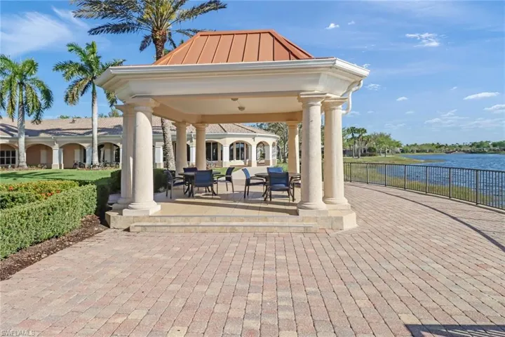 View of community with a water view and a gazebo