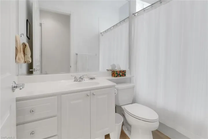 Bathroom with vanity and a shower with curtain