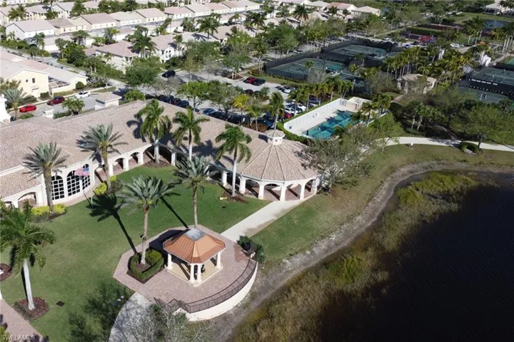 View of property location with a large body of water and nearby suburban area