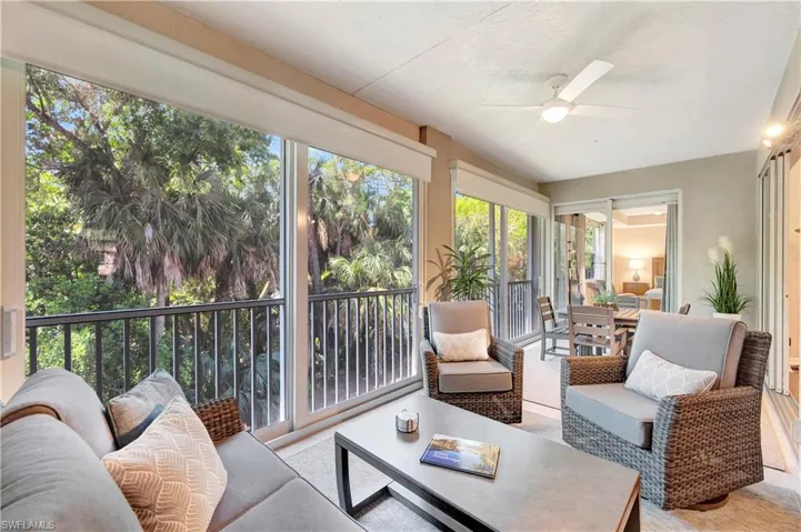 Sunroom with an outdoor hangout area and ceiling fan