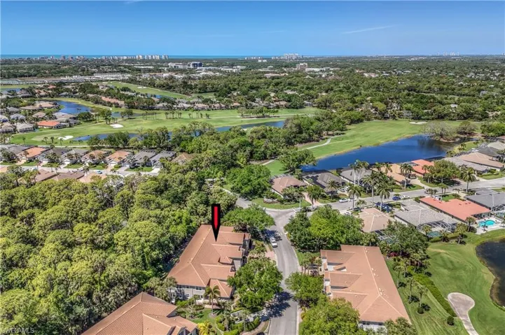 Bird's eye view with view of golf course, a water view, and a residential view