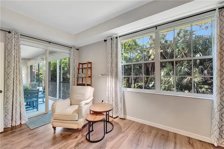Sitting room featuring wood finished floors and baseboards