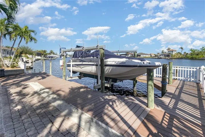 Dock area featuring a water view