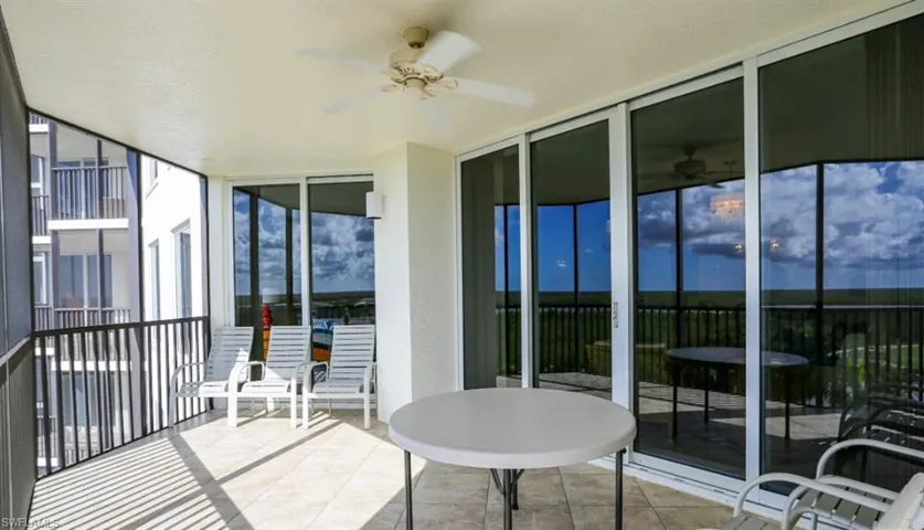 Sunroom / solarium featuring ceiling fan
