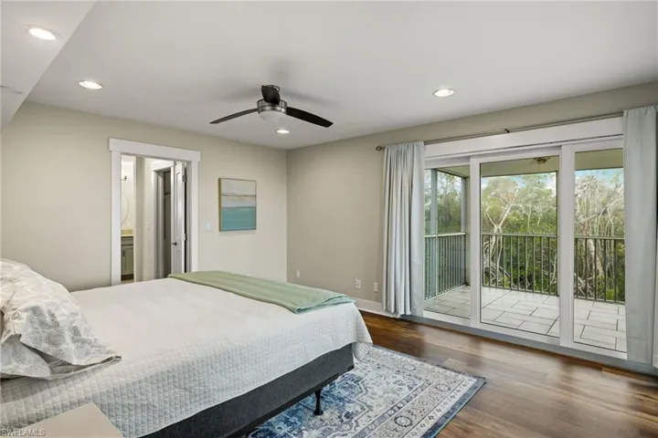 Bedroom featuring recessed lighting, dark wood-style floors, access to exterior, and a ceiling fan