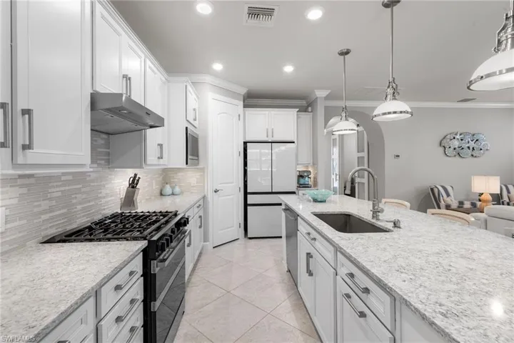 Natural gas range, walk-in pantry behind door