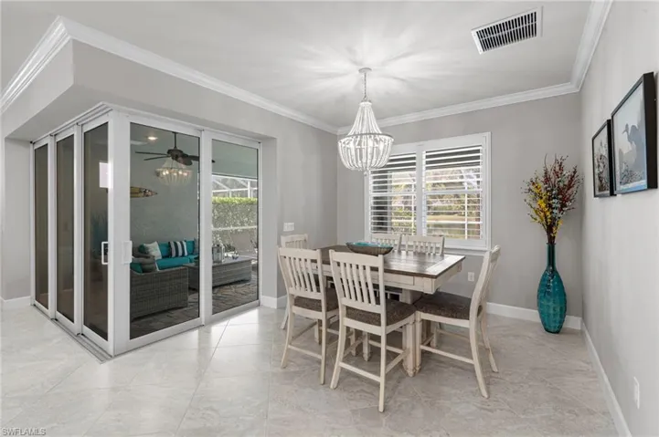 Dining area next to sliders to lanai