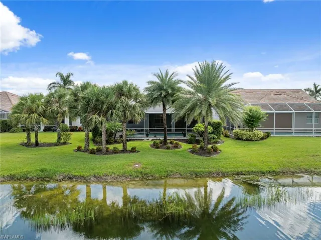 Aerial view of rear of home showing custom landscaping