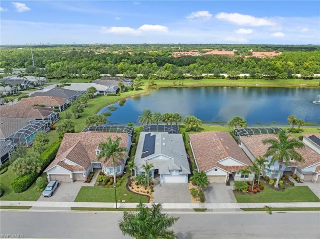 Aerial view of home showing lake behind