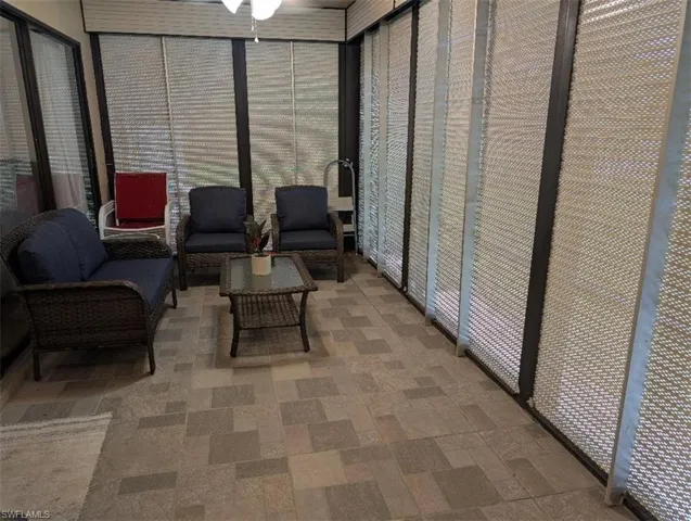 Sunroom featuring outdoor lounge area