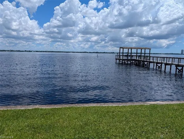 Dock area featuring a water view