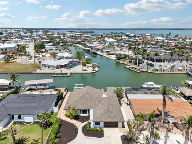 Aerial view of residential area with a large body of water