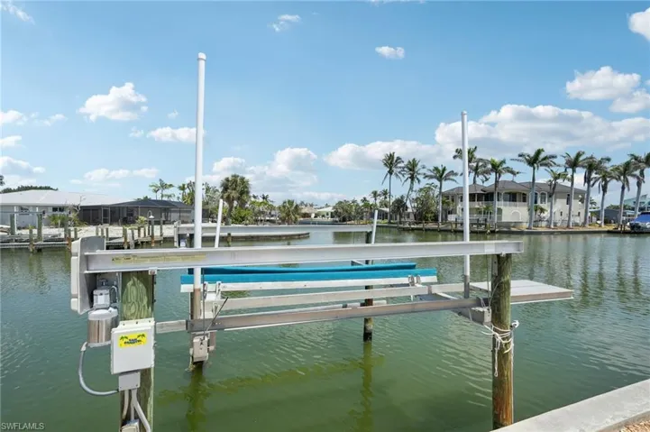 Dock featuring a water view and boat lift