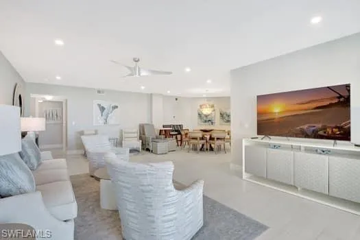 Living room with recessed lighting and ceiling fan