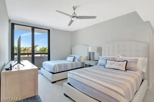 Bedroom featuring access to exterior, light carpet, and ceiling fan
