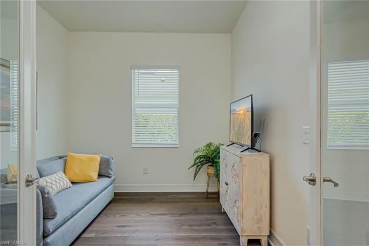 Living area with wood finished floors and french doors