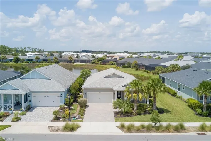 Aerial perspective of suburban area with a nearby body of water